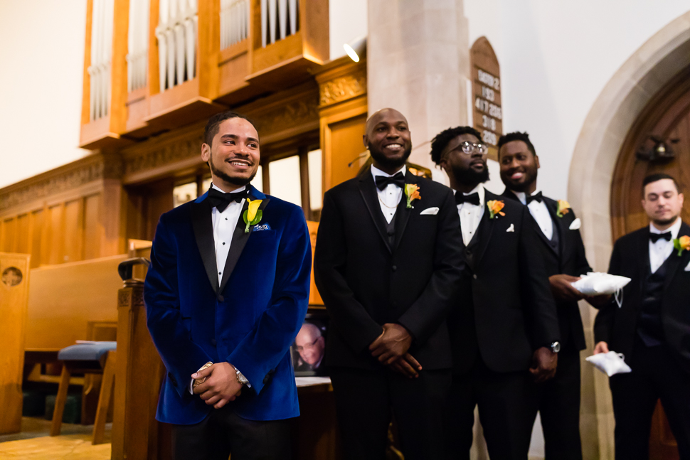 Groom watching Bride come down the aisle