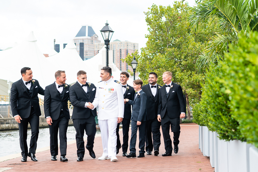 Wedding at Baltimore Harbor groomsmen in front of Baltimore Marriott Waterfront
