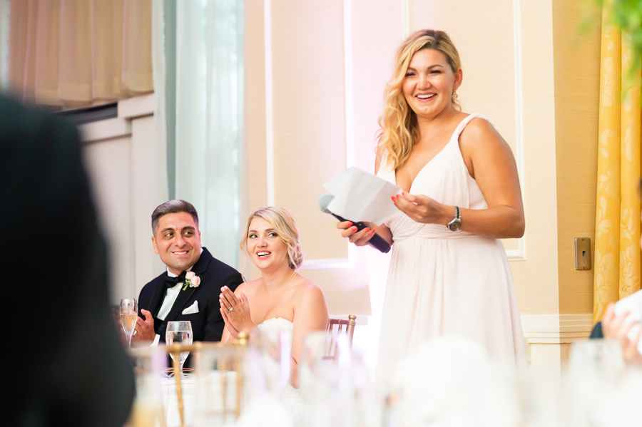 brides sister toasting the couple