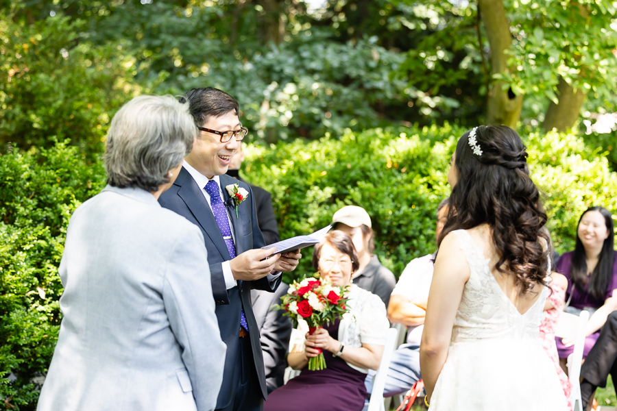 groom reading wedding vows