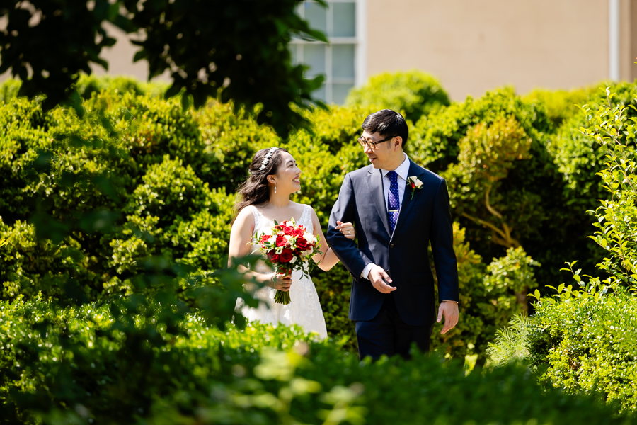 bride and groom walking the grounds of Tudor Place DC