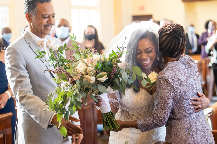 bride greeting mother at the ceremony