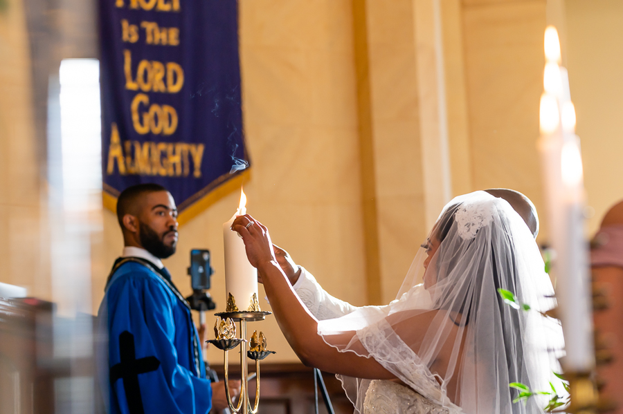 bride and groom lighting ceremony candle