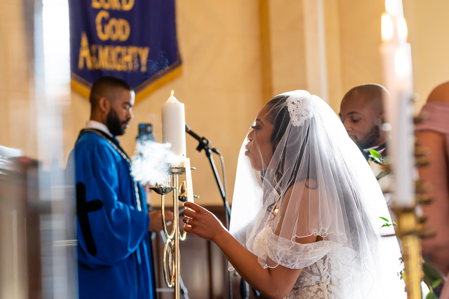 bride and groom lighting ceremony candle