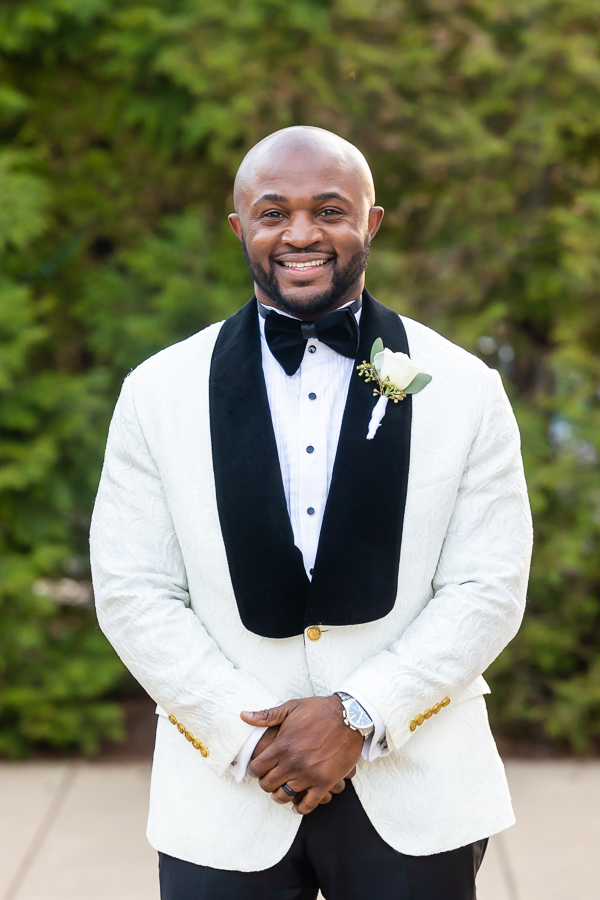 Handsome groom portrait in Fox Chase Manor Weddings setting