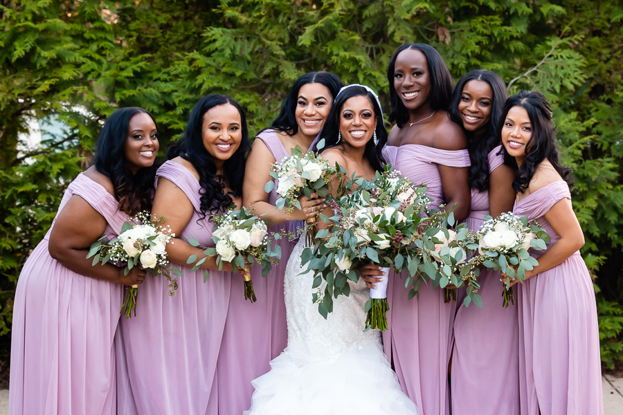 Bride and bridesmaids portrait at Fox Chase Manor Weddings