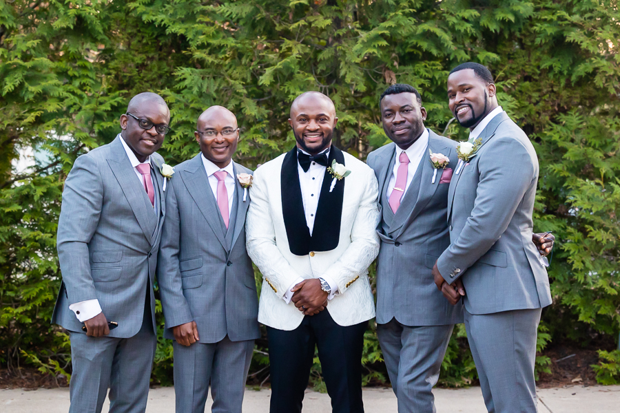 Groom’s candid moment with his groomsmen at Fox Chase Manor Weddings.