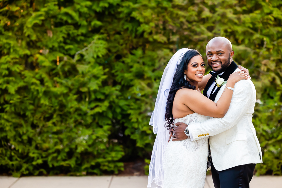 Bride and groom embrace during Fox Chase Manor Weddings