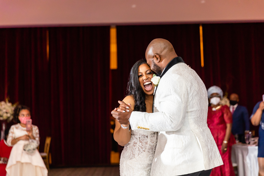 Bride and Groom sharing a laugh at the Fox Chase Manor Weddings reception.