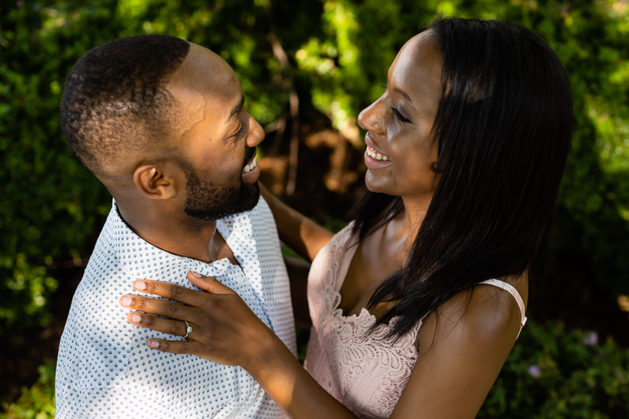 Couple's smile glowing during their Navy Yard Waterfront engagement session.