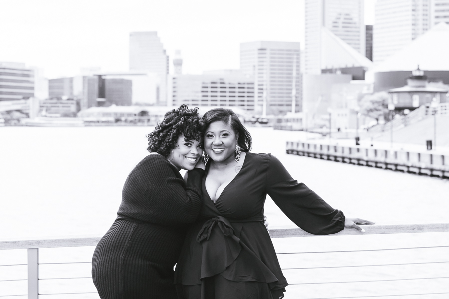 LGBTQ Couples Love Baltimore – Romantic engagement photo at Inner Harbor waterfront
