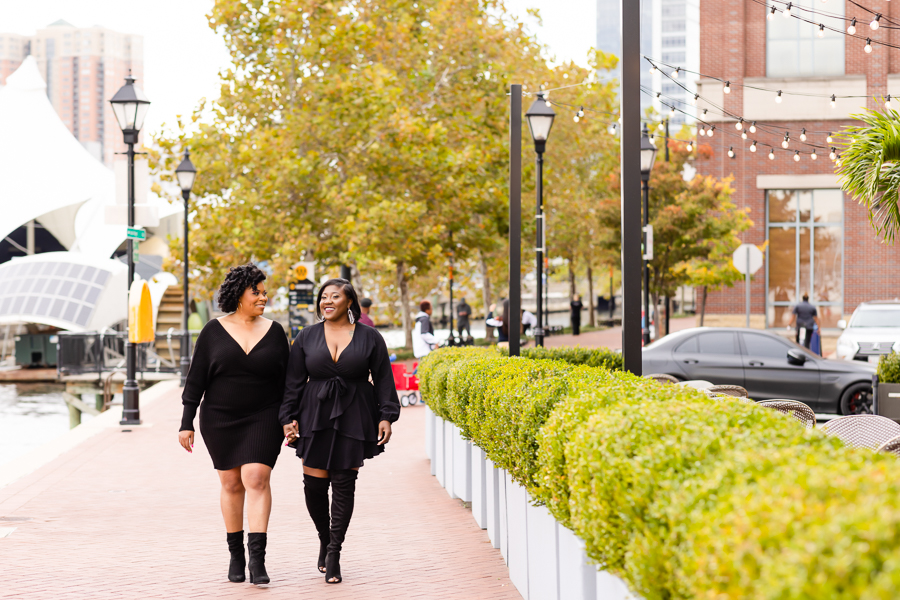 LGBTQ Couples Love Baltimore – Walking along the waterfront promenade in Inner Harbor