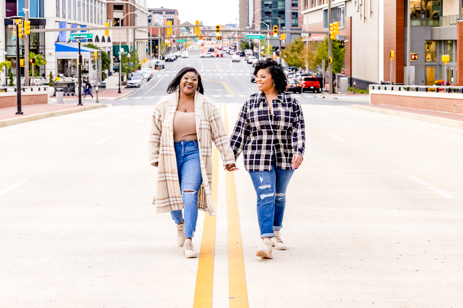 LGBTQ Couples Love Baltimore – Holding hands on a charming Inner Harbor bridge