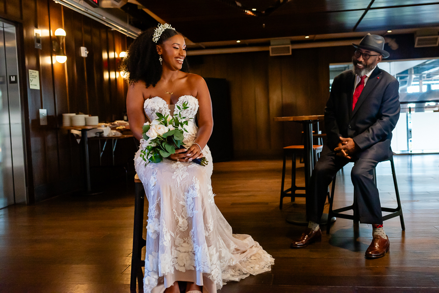 Bride chatting with her dad before walking down the aisle