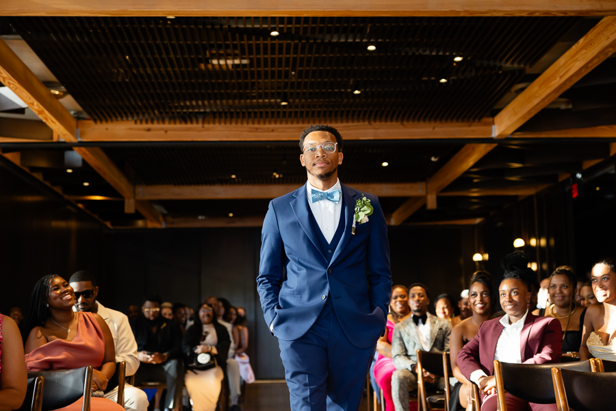 groom making his entrance down the aisle
