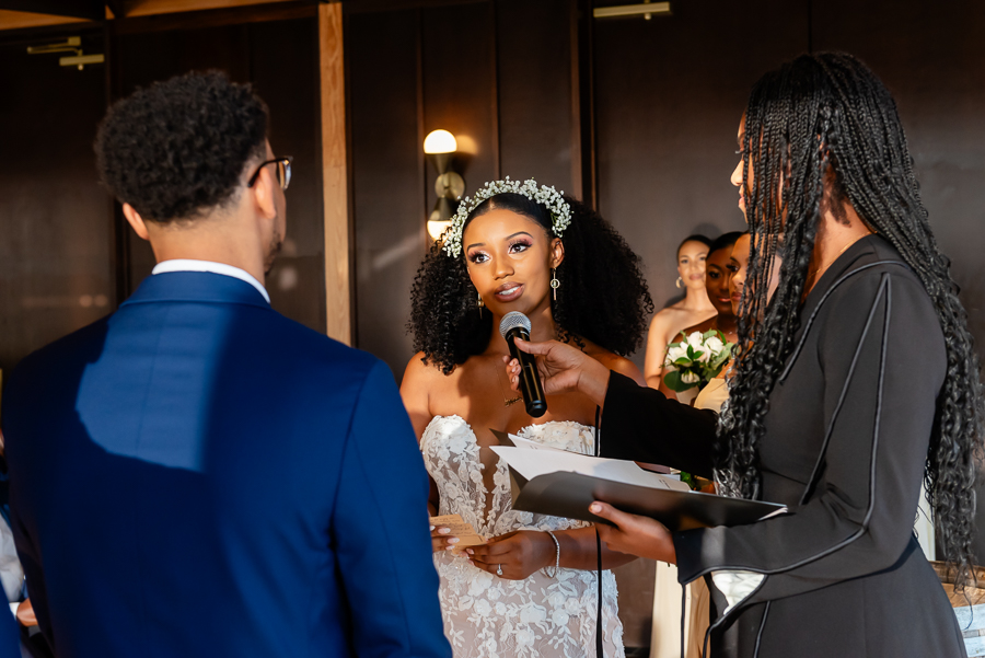 bride exchanging wedding vows with the groom