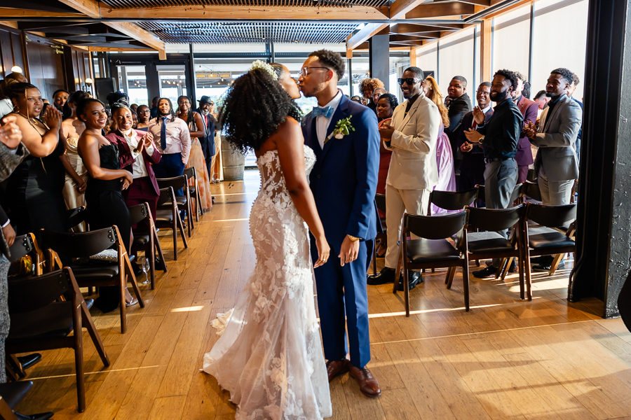 bride and groom share a kiss