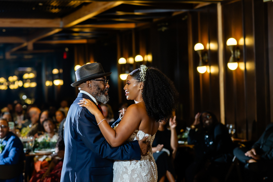 Father-daughter dance under soft lighting – District Winery wedding photography