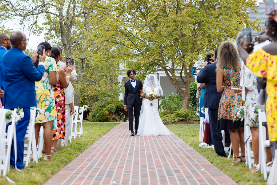 Bride walking down the aisle at River Farm Virginia wedding.