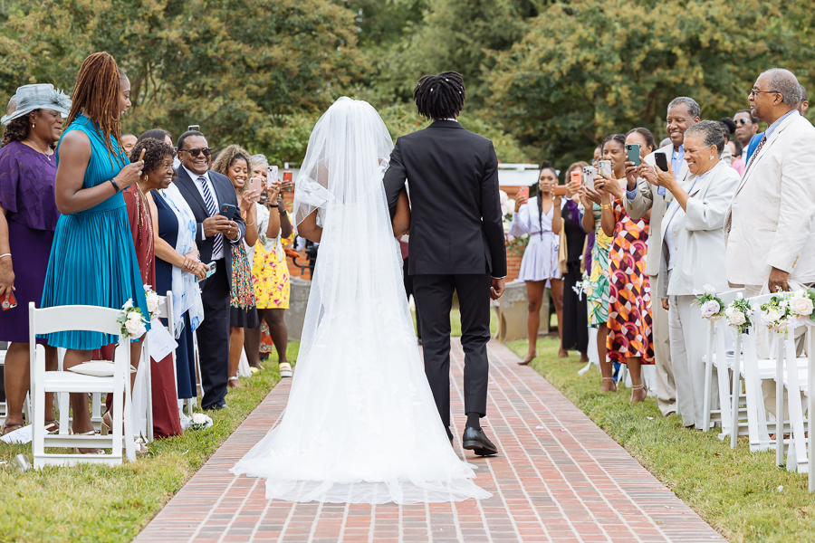 Bride walking down the aisle at River Farm 