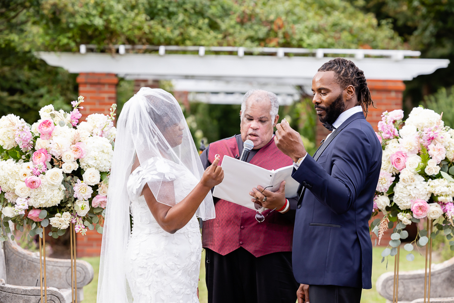 Exchanging wedding rings at River Farm Virginia wedding.
