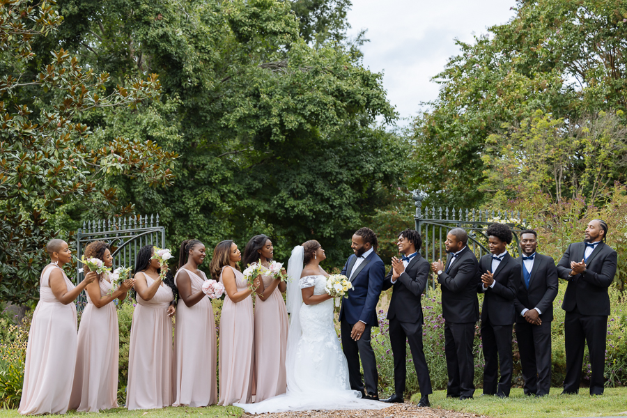 Wedding party posing in gardens at River Farm Virginia wedding.