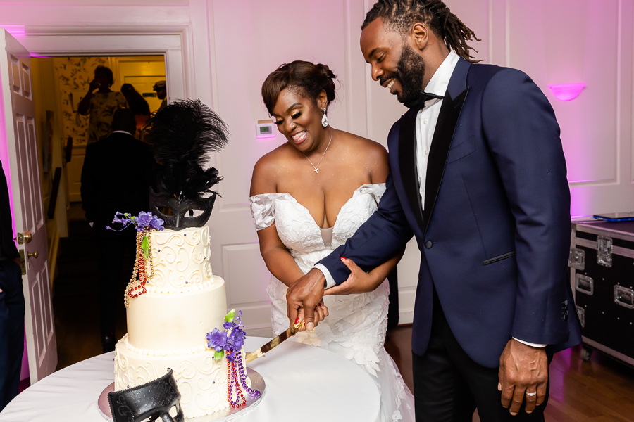 Wedding cake cutting moment at River Farm Virginia wedding.