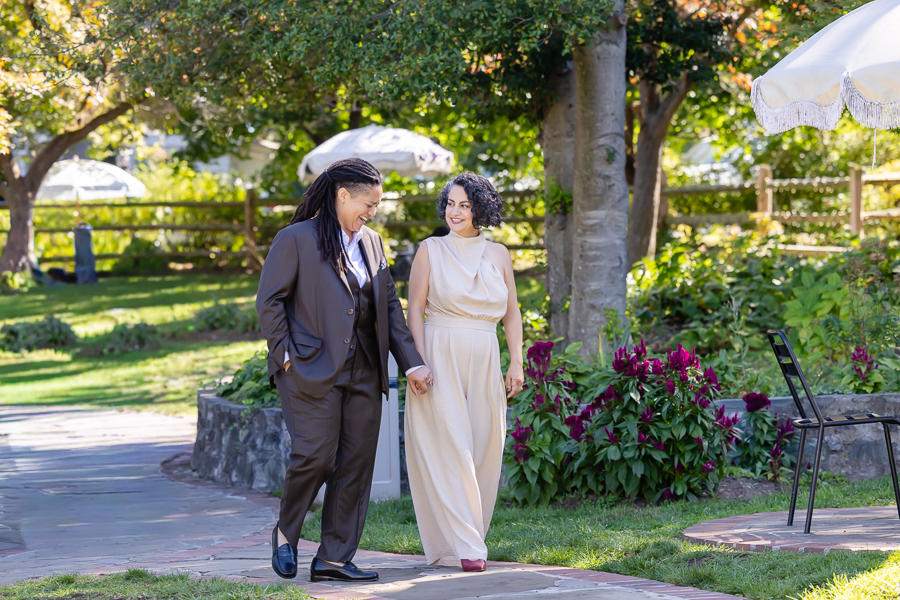 Couple walking through the gardens at Zinnia wedding venue in Silver Spring Maryland