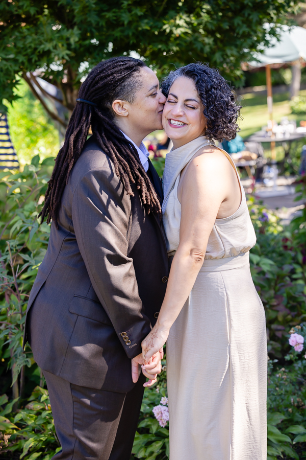Couple embracing under trees at Zinnia wedding venue in Silver Spring