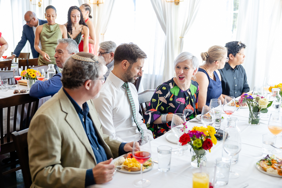 Candid wedding moment of guests enjoying the celebration at Zinnia