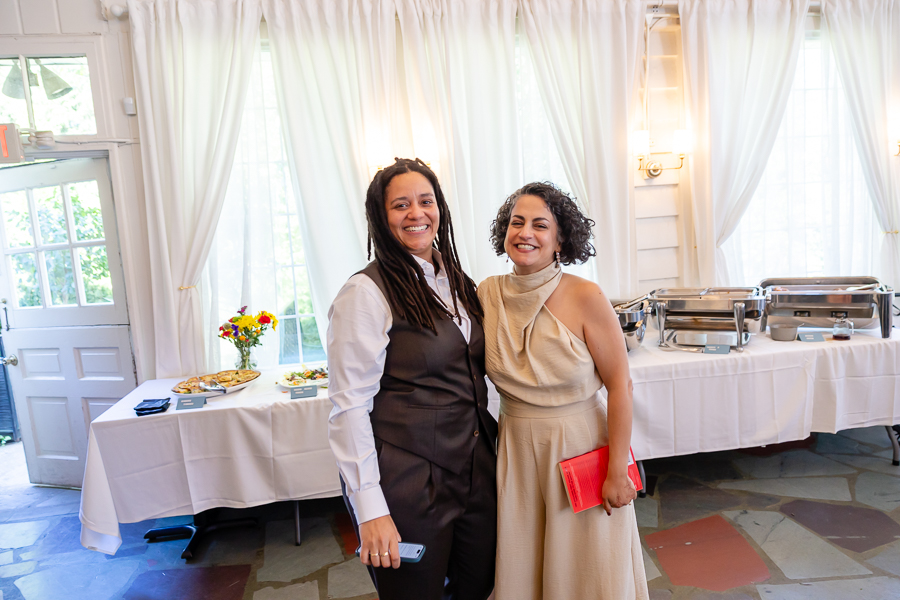 laughing together during their intimate wedding reception