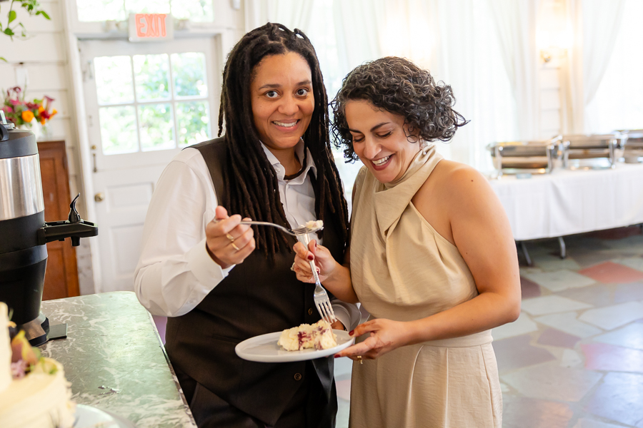 Wedding cake cutting moment at Zinnia restaurant wedding celebration