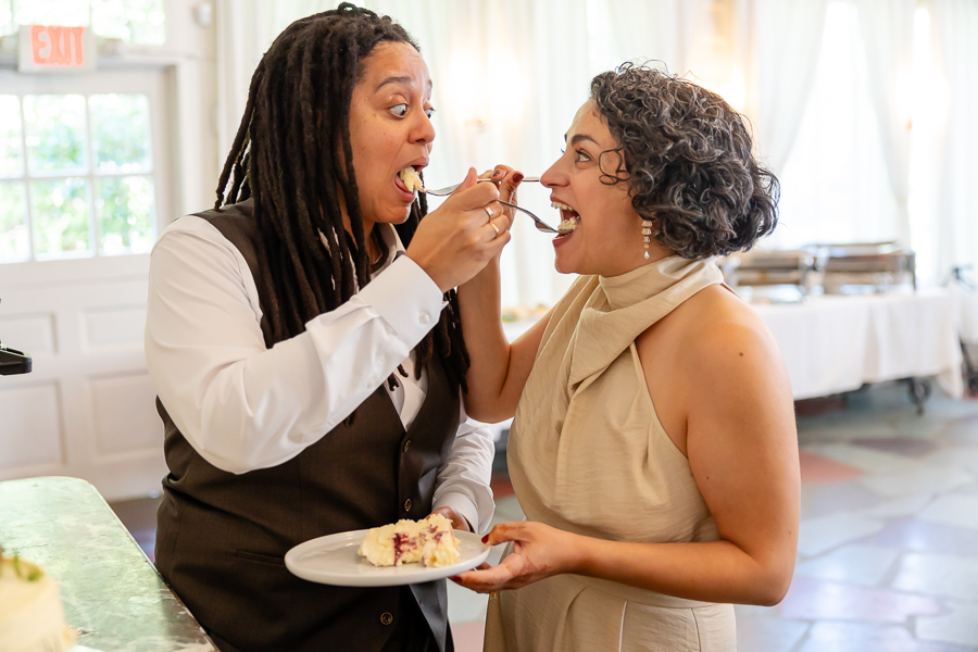 Wedding cake cutting moment at Zinnia restaurant wedding celebration