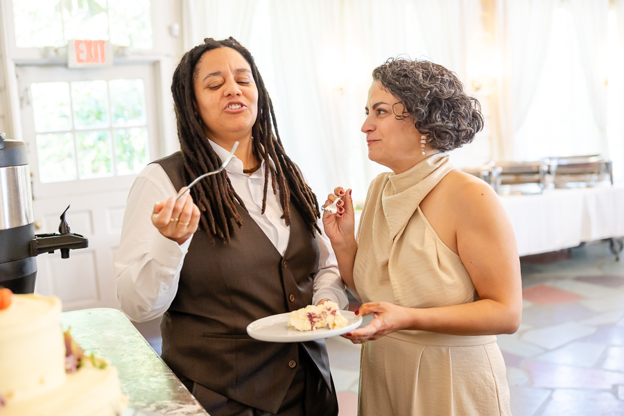 Wedding cake cutting moment at Zinnia restaurant wedding celebration